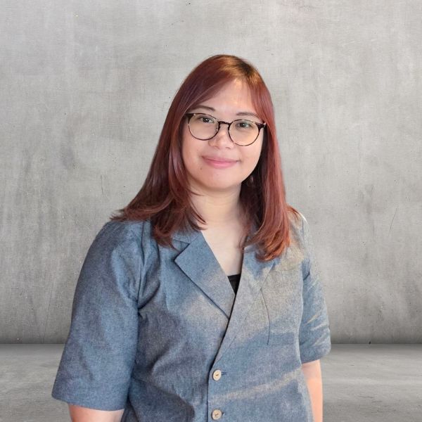 Micaela Reyes seated beside a laptop